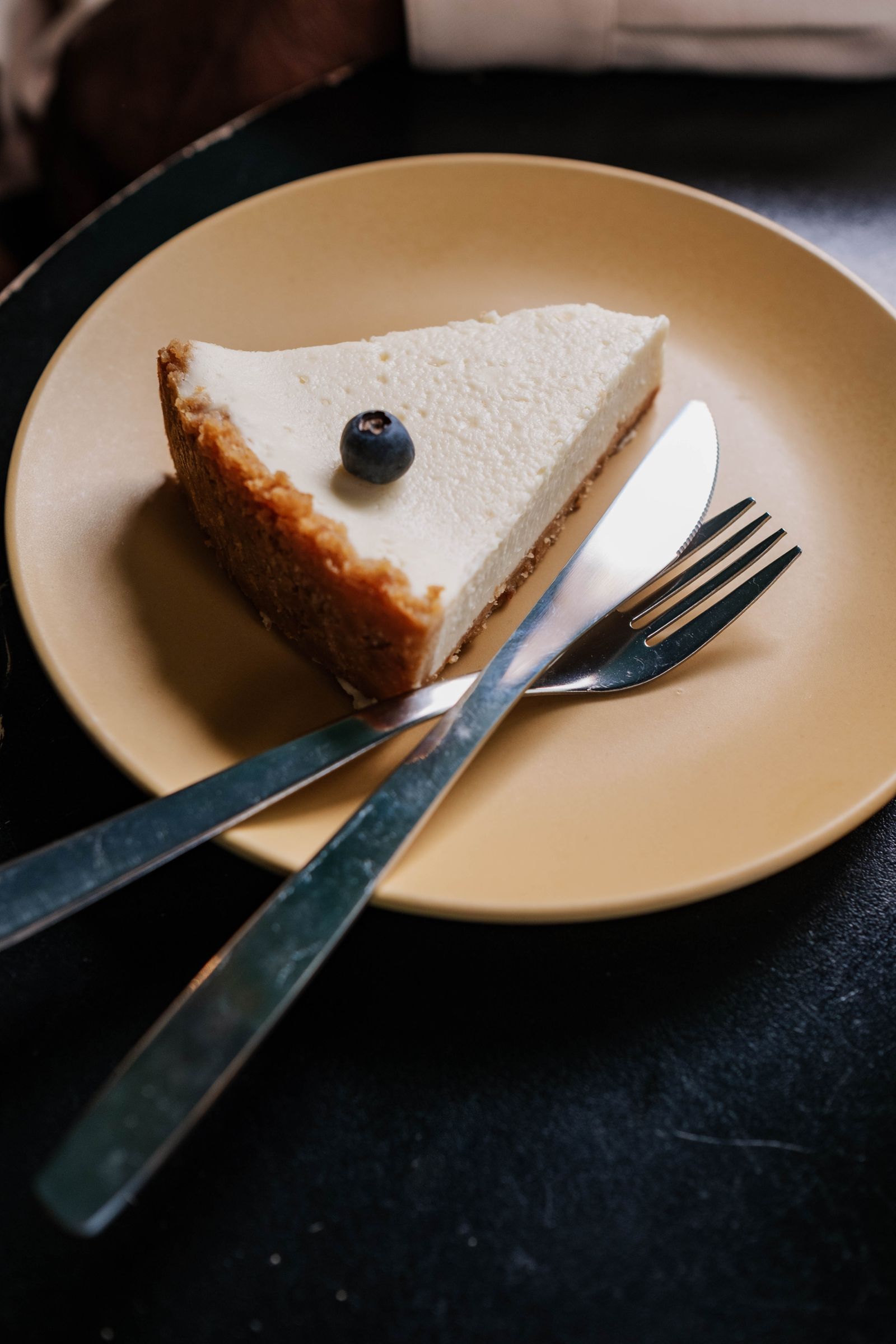 Blueberry cheesecake slice on a plate