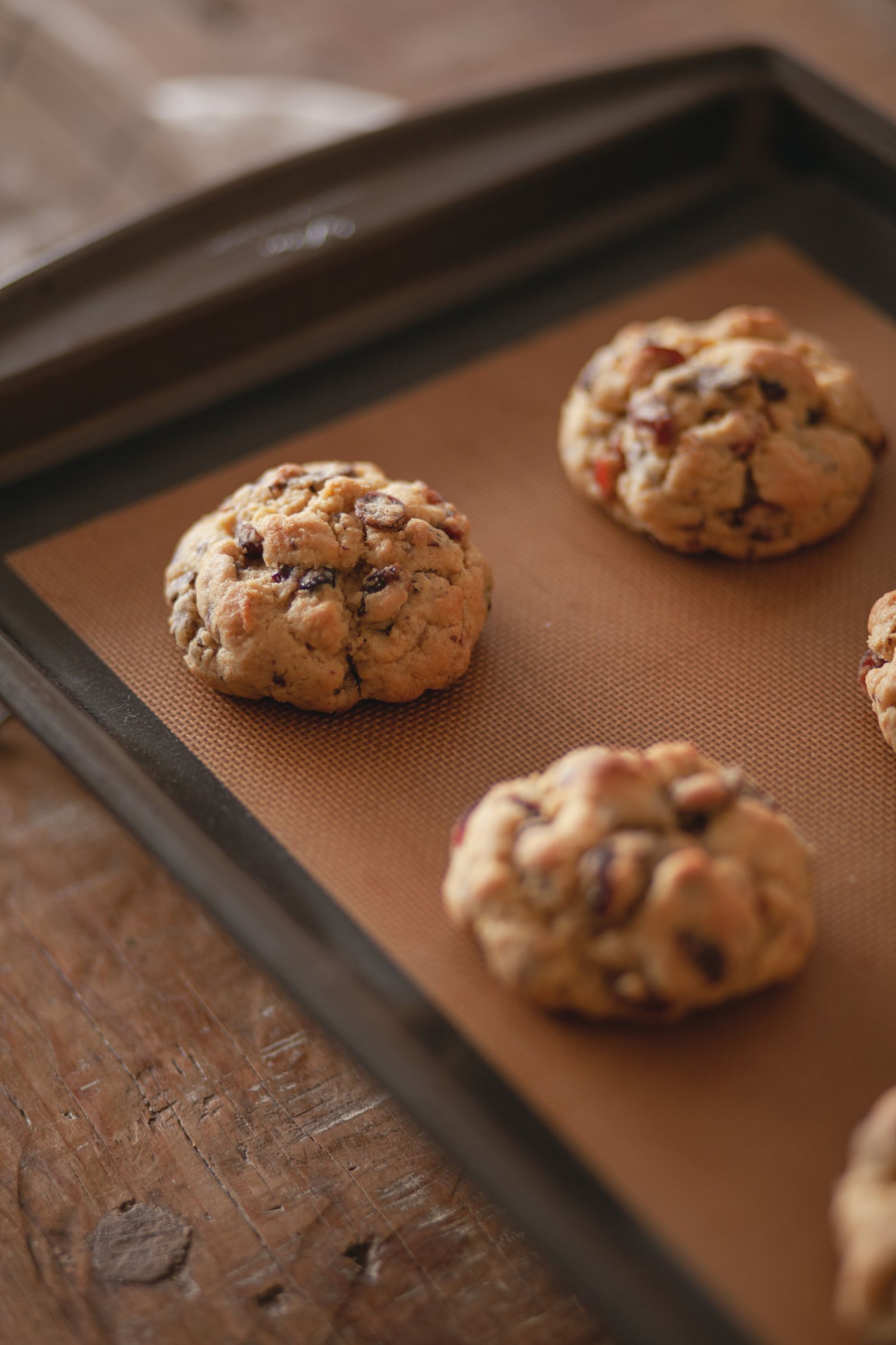 Chocolate chip cookies arranged on a baking tray